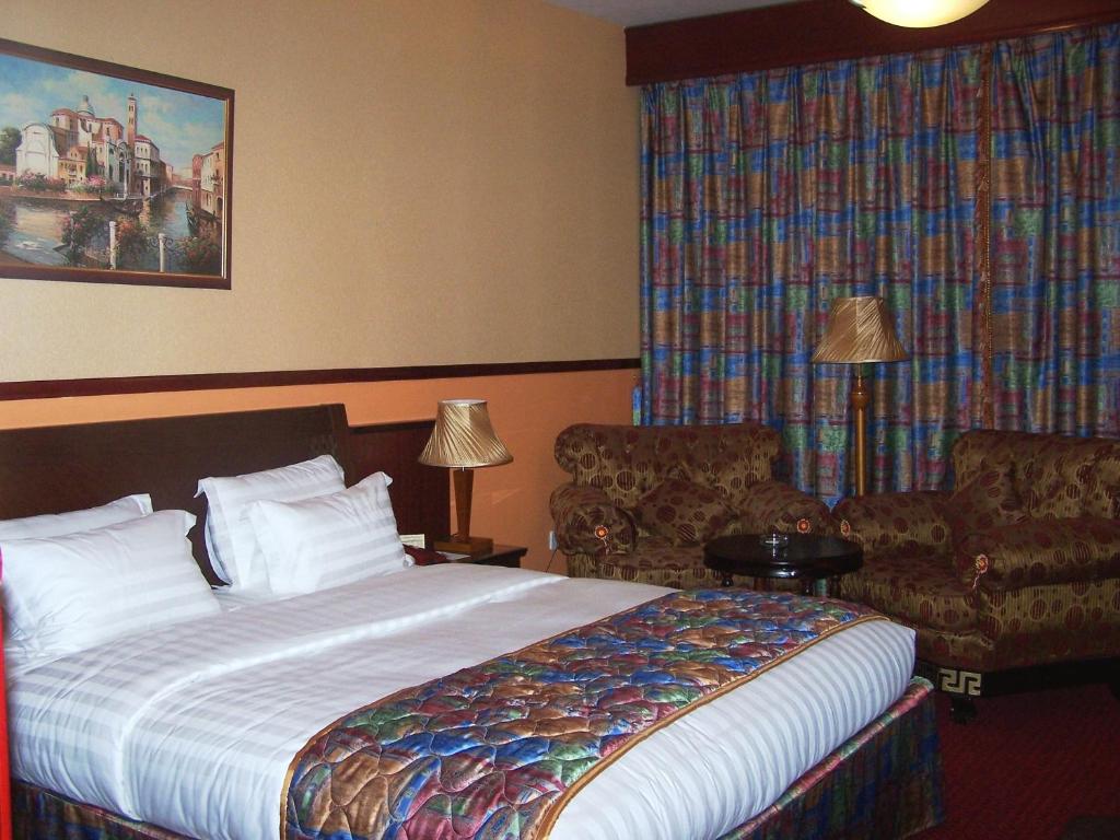 Double room with patterned bedspread