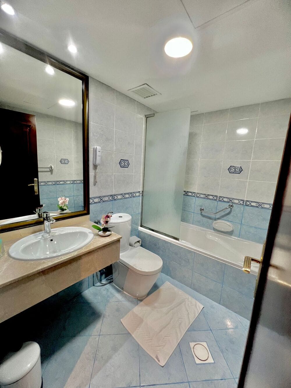 Guest bathroom with a full-length bath
